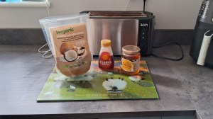 Coconut sugar, maple syrup, and honey on a worktop