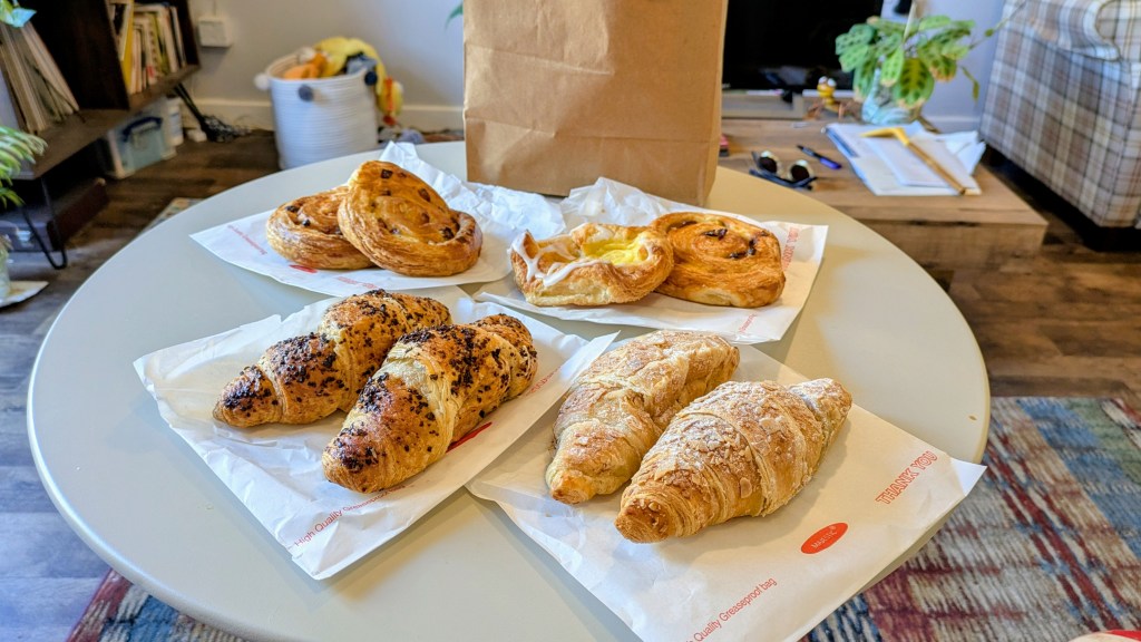 A selection of croissants and pastries on a coffee table
