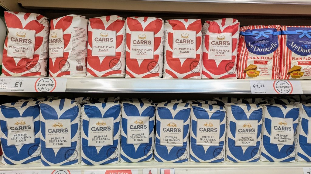 Plain flour and self raising flour on a supermarket shelf