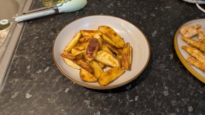 Foodi Max potato wedges on a plate