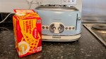 Birds Eye potato waffles in front of a retro blue toaster on a worktop