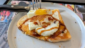 Yolk of fried egg cooking in a ramekin in an air fryer