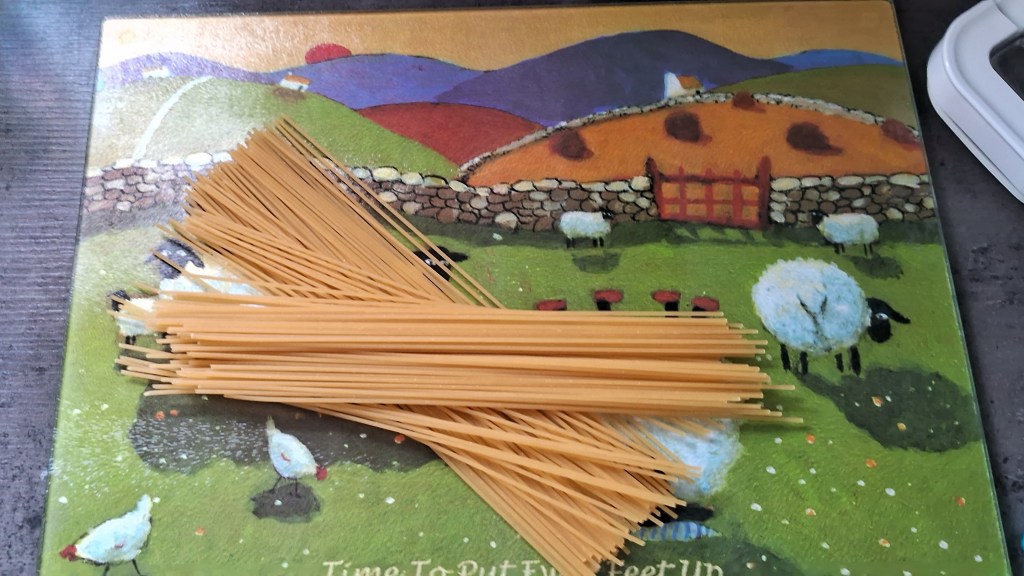 Spaghetti on a chopping board