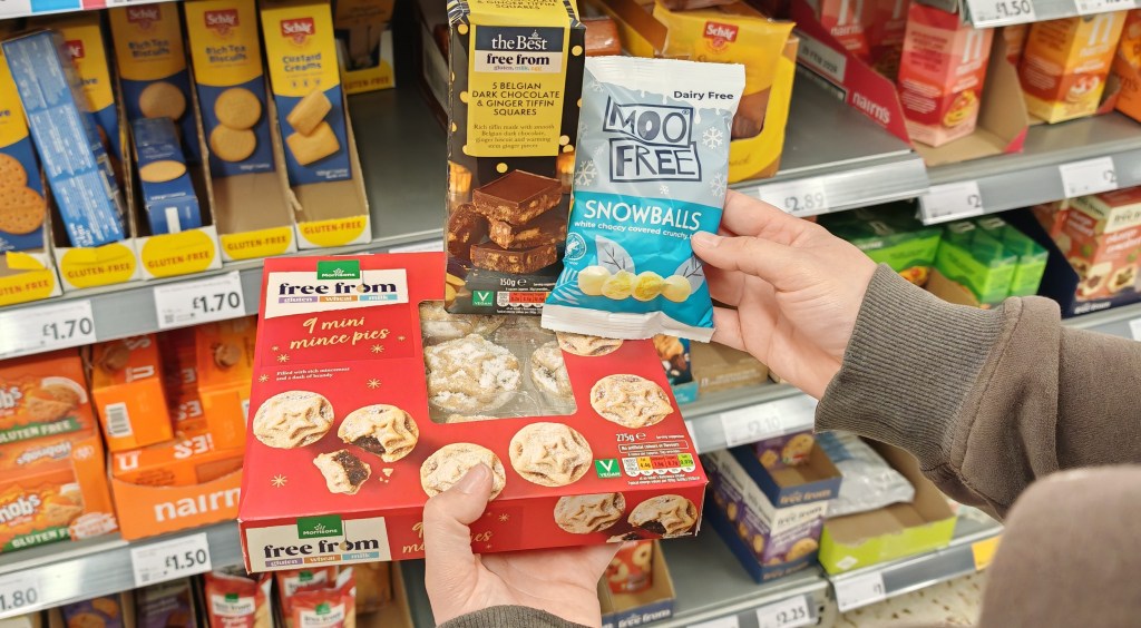 The Moo Free snowballs, free from mince pies and Belgian dark chocolate and orange tiffin squares being held in the Morrisons Free From aisle