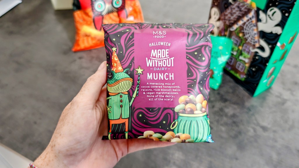 M&S Made Without Dairy Munch sweet being held