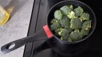 Broccoli florets in a saucepan