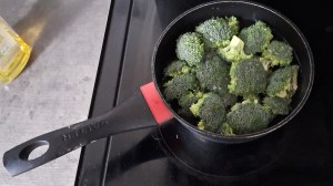 Broccoli florets in a saucepan