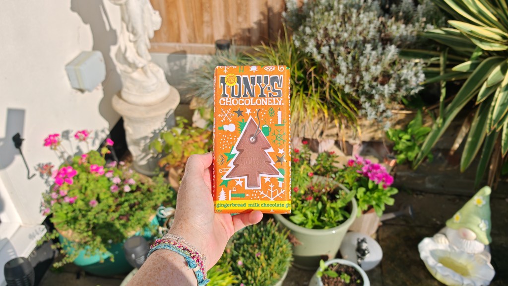 Tony's Chocoloney Gingerbread bar being held outside